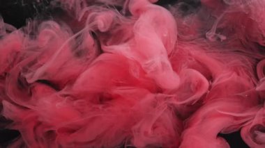 Puslu bir arkaplan. Soyut boya. Odaklanamayan pembe renkli ruhani bulut akan su sıvısı kimyasal siyah sanata yayılıyor..