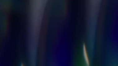 Bulanık renkli ışık. Soyut parti geçmişi. Odaksız sızıntı. Sarı ışınlar. Gökkuşağı rengarenk ışınlar..