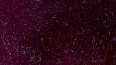 Köpüklü sıvı. Pırıltılı sis. Odaklanmamış pembe renk sıvı parlak partikül doku dairesi su soyut sanat arka planında harmanlanıyor.