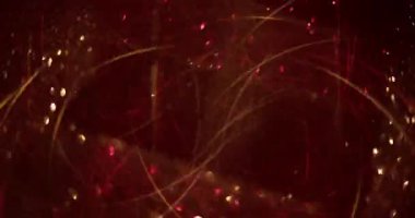 Görüntü pırıl pırıl. Yuvarlak titreşim. Sanat rengarenk ışıltı kırmızı altın soyut arka planda parlak yuvarlak parçacıklar hareketi.