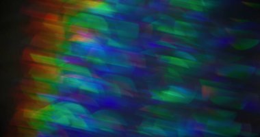 Lens fişeği. Odaklanamayan parıltı. Renkli mavi turuncu parlayan kaleydoskop bokeh ışığı modern arkaplanı bulanıklaştırdı.