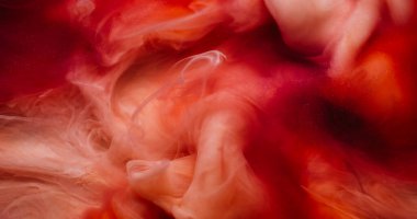 Dalga dokusu. Boya karışımı. Odaklanmamış mor turuncu dumanlı kimyasallar soyut sanat arka planında parıldıyor..