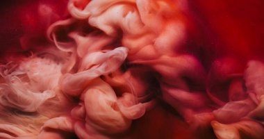 Sis dokusu. Mürekkep suyu. Odaklanmamış pembe renk duman kimyasal madde sıvı dalga sıvısı soyut sanat arka planında hareket ediyor.