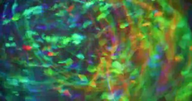 Kaleydoskop sanatı. Bulanık renkli hareket. Görkemli yeşil turuncu optik mercek parlayan daireler Bokeh light arkaplanı açıyor.