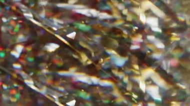 Bulanık renkli konfeti. Lüks ışık. Parlak sarı parçacıklar yanıp sönen kıvrımlar soyut şenlik sanatının arka planında hareket ediyorlar..