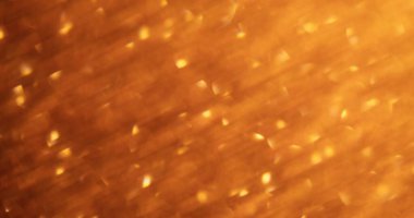 Bokeh parıltısı. Odaklanamayan ışık. Bulanık altın rengi, ışıltılı sanat arkaplanda parıldayan mercek parlaklığı.