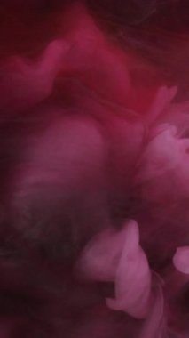 Dikey video. Parıldayan duman. Sisli bulut. Dönen dokunuş. Kanat çırpan peçeler. Kırmızı ve beyaz, soyut arka planda parıldayan modern sanat ciltleri.