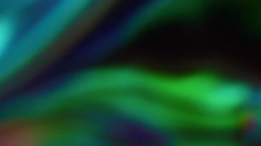 Folyo taştı. Odaklanmamış titreşim. Parti bokeh etkisi. Gökkuşağı renklendirme renk değişimi parlaklığı. Soyut sanat geçmişi. Neşeli ruh hali yavaş çekim.