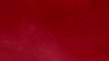 Duman sıvısı. Bulanık sis bulutu. Işıl ışıl parlayan kırmızı kabarık akıntılar ışıl ışıl boya mürekkep parlak kıvrımlar modern soyut arka planda dönüyor..