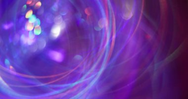 Işıl ışıl parlıyor. Odaklanamayan daire parıltısı. Parlayan mor turuncu çok renkli çizgiler mercek soyut bokeh ışık arkaplanı.