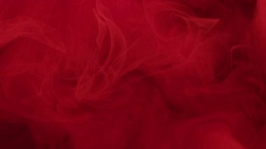 Mistik boya. Magenta akışı. Sis rengi bulanıklık ve soyut bir arka plan. Mürekkep dumanı suda çözünür. Küçük pembe parçacıklarla karışır..