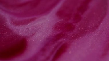 Mürekkep suyu. Odaklanmamış sim sıvısı. Parlak pembe renkli akış bulanık bokeh ışık modern soyut sanat arka planında hareket ediyor..