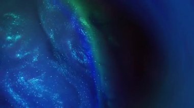 Sanat sıvısı. Duman boyası. Mavi, yuvarlak, yeşil, pırıl pırıl, sisli, girdaplı, karışık su. Parlak sıvı akışı soyut kozmik arkaplan.