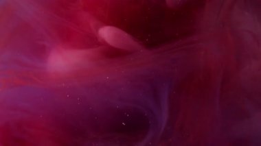 Mürekkep dumanı. Suluboya patladı. Sanatta kırmızı menekşe beyaz duman sıvısı karışımı bulanık boya suyu. Dalga buharı patlama dokusu soyut arkaplan.