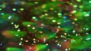 Parlak ışık. Bulanık parlak ışınlar. Parıldayan parçacıklar mercek parlamaları, bokeh efektli modern soyut sanat üzerinde hareket ediyorlar..