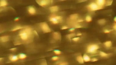 Bokeh hafif dokusu. Bulanık parçacıklar. Altın sarısı renkli parlak kıvılcımlar modern soyut arka planda hareket ediyor..