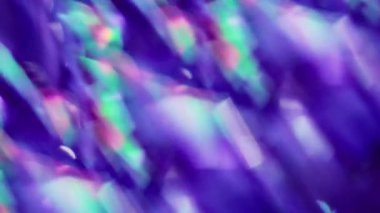 Odaklanamayan ışın. Çoklu renkli kaleydoskop. Işıl ışıl yeşil gözlük, kırmızı lens. Sanatta yanıp sönen ışık, soyut ve bulanık arkaplan..