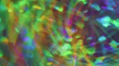 Kaleydoskop kıvılcımı. Bulanık çok renkli lekeler. Yeşil turuncu mavi yanıp sönen daire mercek ışıltılı şeritler Bokeh ışığı soyut arkaplanı açıyor.