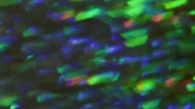 Çok renkli bir parıltı. Bulanık parlak bir ışık. Bokeh Işığı soyut arka planında parıldayan ışıltılı bir kaleydoskop lensi..