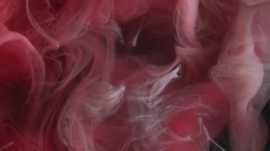 Dalga sisi. Duman mürekkebi. Kırmızı turuncu peçeli sıvı boya su fantezi dokusunu karıştırır. Soyut zerafet akışı sıvı boya dumanı bulanık siyah arkaplan.