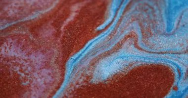 Sıçrama sanatı. Mürekkep döküldü. Odaklanmamış turuncu mavi renkli parlak parçacıklar soyut yaratıcı arka planda yüzüyor..