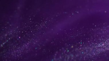 Parıltı dumanı dağıttı. Parlak karışım. Renk sıvısı neon akışı parıldayan konfeti sızıntısı. Işıl ışıl mor renkli su, soyut arkaplan bulanıklığı.