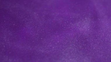 Parıltı dalgası. Mistik bulanık sıvı. Toz bulutu mürekkep emülsiyonu. Mor mor renk soyut scintilla arkaplan dokusunu parlatır.