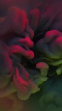 Dikey video. Boya patlaması. Renkli akış. Sis sıvısında duman bulutu patlaması. Gizemli su grunge soyut arkaplan bulanıklığı .