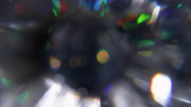 Top parıldıyor. Görüntü pırıltısı sanatı. Odaklanmamış yuvarlak şekil parıltısı mercek gökkuşağı daire spektrumu parlaklığı soyut ışık arkaplanı üzerinde titreşir.