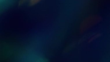 Işıl ışıl. Bulanık mercek. Modern optik koyu siyah arkaplan üzerinde sönük yeşil, altın parıltılı parlak ışık dokusu.