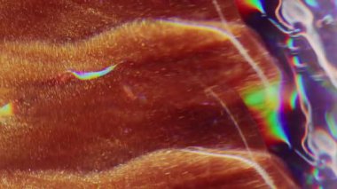 Işıltılı damlalar. Odaklanamayan ışıldayan lifler. Işıldayan turuncu renkli mercek alev alev yanan boya parçacıkları bulanık bokeh hafif modern arkaplanda hareket ediyor.