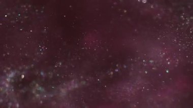 Parıltı dalgası. Odaklanmamış parıltı. Toz akışı karışım mürekkep sisi emülsiyonu. Mor pul renkleri parlak desen soyut bulanık arkaplan.