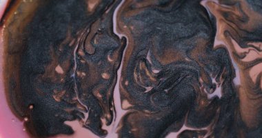 Mermer dalga. Kabarcık arkaplan. Odaksız pembe bronz renk pigmenti akrilik ıslak emülsiyon damlası yaratıcı sanat soyutlamasında daireler çiziyor.