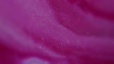 Mürekkep suyu. Odaklanmamış sim sıvısı. Parlak pembe renkli akış bulanık bokeh ışık modern soyut sanat arka planında hareket ediyor..