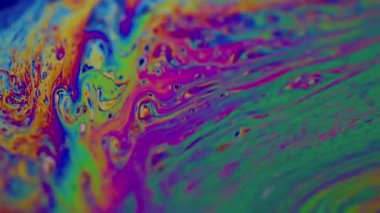 Sabun yağı girdabı. Boya karışımı. Çok renkli, sıvı, canlı dalga pigmenti arkaplanı. Soyut eğimli petrol sızıntısı bulanık sıvı.