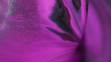 Parlak pigment. Odaklanamayan ışıl ışıl akış. Pembe mor mürekkep damlayan daire çerçevesi. Soyut şelale rengi girdap arkaplanı.