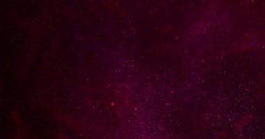 Bokeh sanatı. Parıldayan ışık. Soyut parlak siyah arkaplanda odaksız kırmızı renkli optik parlak parlak parlak yuvarlak dokular.