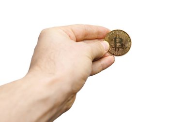 on a white background, a hand in fingers that are a gold coin Bitcoin