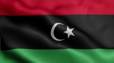 Libya bayrağı rüzgarda dalgalanıyor.