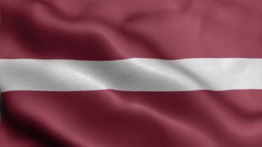 Letonya bayrağı rüzgarda dalgalanıyor.