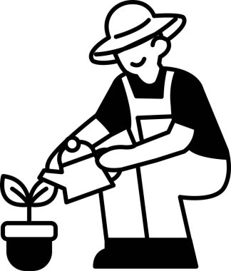 Şapkalı ve tulumlu bir adam çiçekleri suluyor.