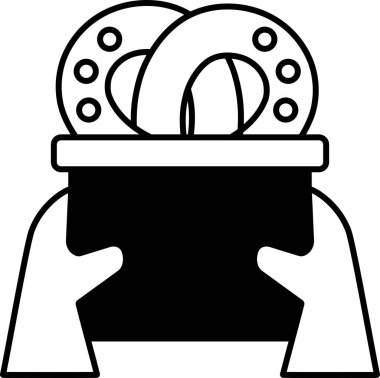 Bir kişi içinde iki çörek olan bir kap tutuyor.