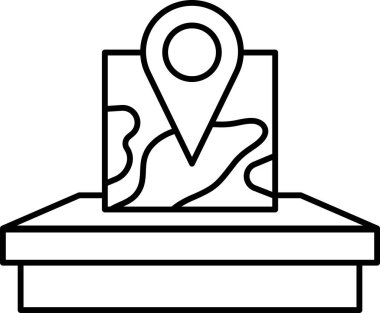 Bir yeri gösteren siyah işaretli bir harita. Harita masanın üstünde.