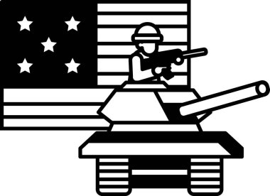 Bir asker elinde silahla bir tankta oturuyor. Tank bir Amerikan bayrağının yanında.