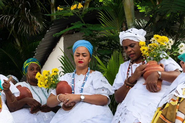 stock image Saubara, Bahia, Brazil - June 12, 2022: Candomble members gathered in traditional clothes for the religious festival in Bom Jesus dos Pobres district, Saubara city.