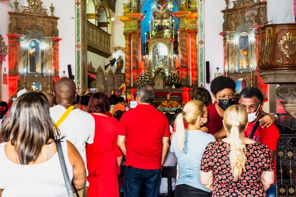 stock image Salvador, Bahia, Brazil - December 04, 2022: Devotees of Santa Barbara during mass in the church of Rosario dos Pretos in Largo do Pelourinho in the city of Salvador.