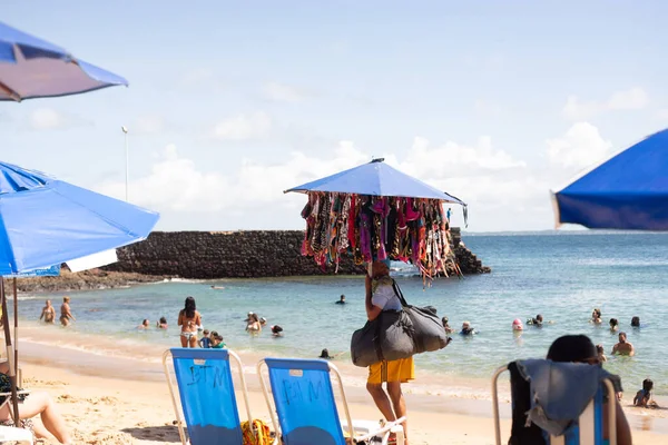 stock image Salvador, Bahia, Brazil - June 04, 2022: People have fun and swim in the sea at Porto da Barra beach in the city of Salvador, Bahia.