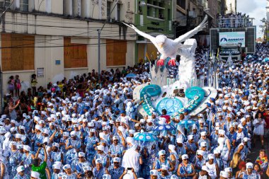 Salvador, Bahia, Brazil - February 11, 2018: Members of the traditional carnival block Filhos de Gandy parade in the streets of Salvador, Bahia during the 2018 carnival.