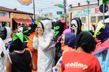 Maragogipe, Bahia, Brazil - February 27, 2017: Group of people parading dressed in horror costumes at the carnival in Maragojipe, Bahia.