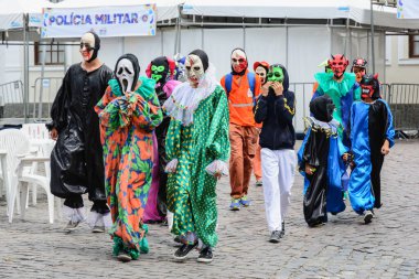 Maragogipe, Bahia, Brazil - February 27, 2017: Group of people parading dressed in horror costumes at the carnival in Maragojipe, Bahia.